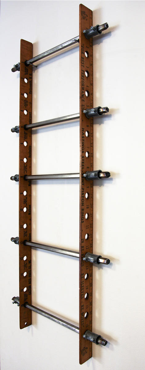 'JASPER' - 2013
 (36"x16"x2")
vintage piston yardsticks, steel rods, fittings
